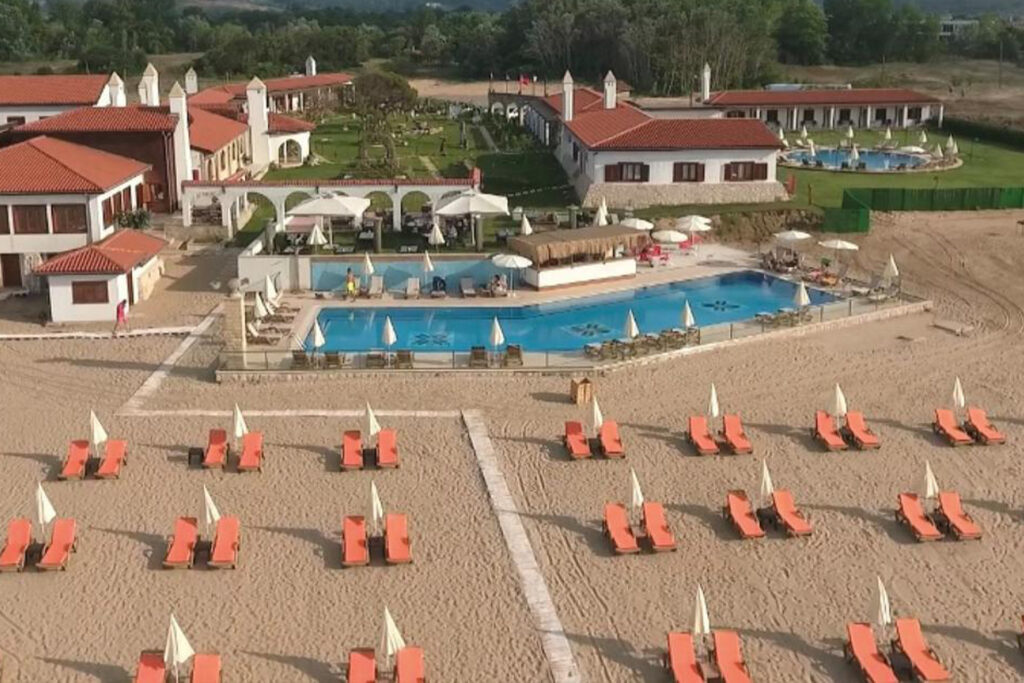 Aerial view of Sile Beach, showing its long stretch of sandy shore and vibrant blue sea