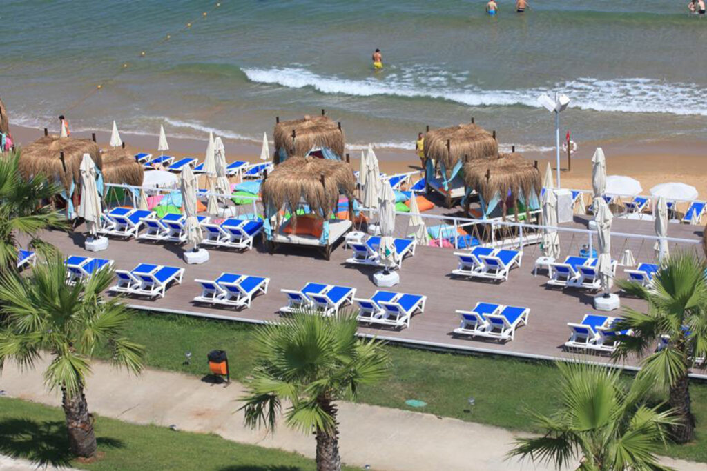 Solar Beach coastline with vibrant umbrellas and beachside cafes