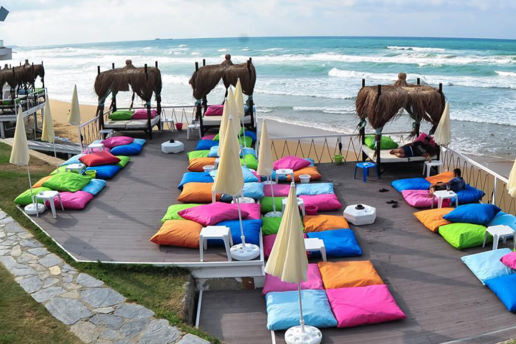 Solar Beach coastline with vibrant umbrellas and beachside cafes